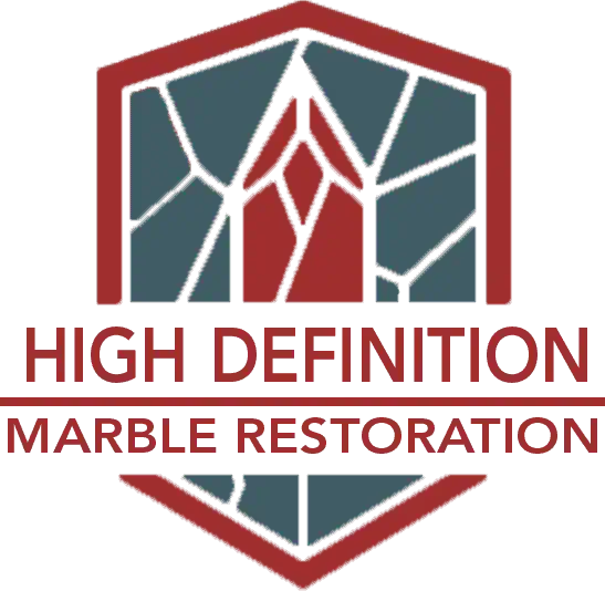 Logo for "High Definition Marble Restoration" featuring a geometric shield with red and gray segments resembling marble veins, and the company name in bold red text below—ideal for marble restoration in Nassau & Suffolk County, NY.